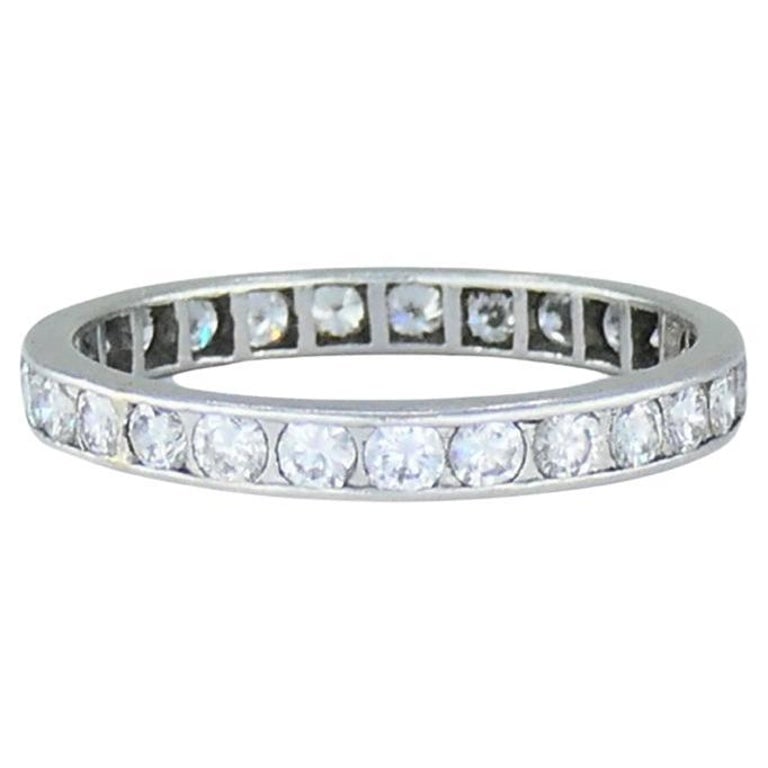 Wedding Band Platinum Diamond Eternity Ring 1960s Estate Jewelry Size 10: Title: Wedding Band Platinum Diamond Eternity Ring 1960s Estate Jewelry Size 10 Description: A wedding band made of platinum, featuring diamonds. This vintage circa 1960s eternity ring has a clean, un