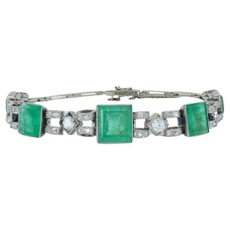 Victorian 18k White Gold Emerald Diamond Bracelet: Title: Victorian 18k White Gold Emerald Diamond Bracelet Description: This Victorian-era bracelet, crafted in the early 1900s, crafted in 18k white gold in a timeless design. Weighing 18.6 grams, the 