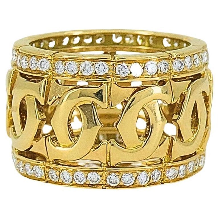 Cartier Entrelaces C de Cartier Diamond Ring Wide Band: Title: Cartier Entrelaces C de Cartier Diamond Ring Wide Band Description: The Cartier Entrelaces C de Cartier Diamond Ring is an exquisite wide band ring featuring distinctive design elements and lux