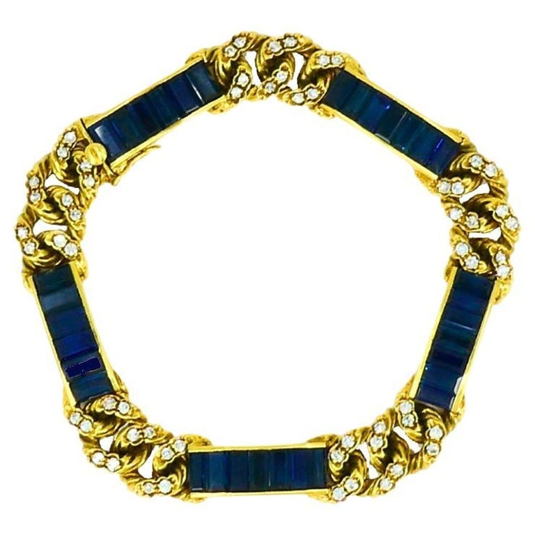 Vintage Fred Paris Bracelet Sapphire Diamond 18k Gold: Title: Vintage Fred Paris Bracelet Sapphire Diamond 18k Gold Description: A vintage Fred Paris bracelet with sapphires and diamonds, crafted in 18k gold. The bracelet features sleek baguette cut blue