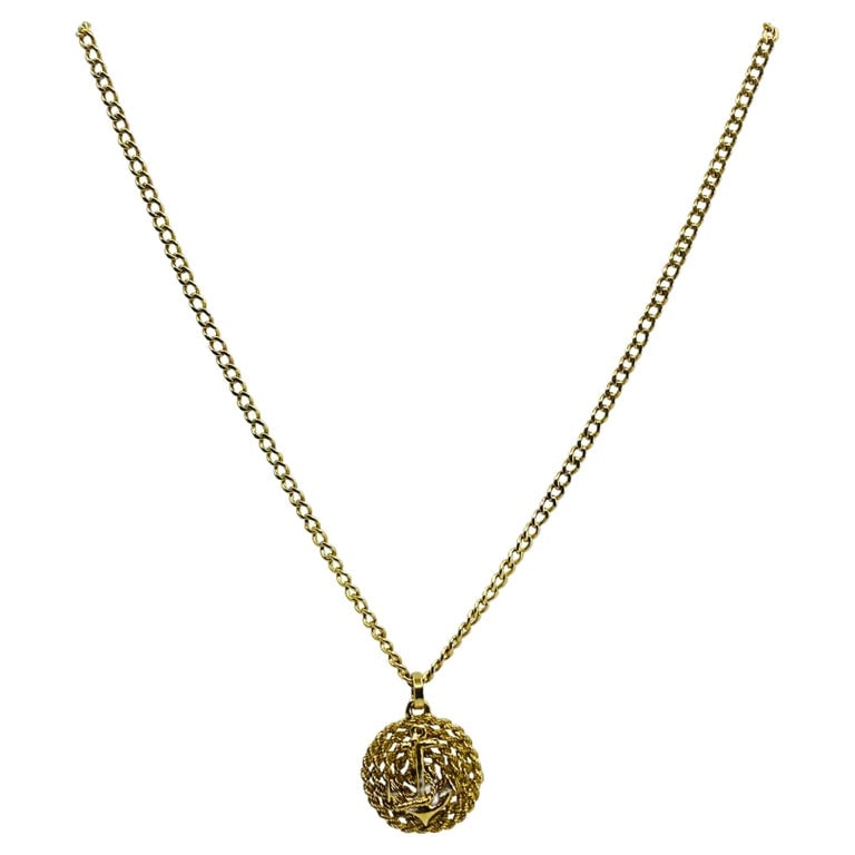 14k Gold Anchor Pendant Rope Design Chain Necklace: Title: 14k Gold Anchor Pendant Rope Design Chain Necklace Description: A 14k gold chain necklace with a rope design anchor pendant. In the jewelry design, anchors symbolize stability and hopefulness.