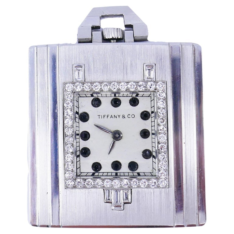 Vintage Tiffany & Co. Pocket Watch Pendant Platinum Diamond Estate Jewelry: Title: Vintage Tiffany & Co. Pocket Watch Pendant Platinum Diamond Estate Jewelry Description: A rare vintage Tiffany & Co. Art Deco Revival pocket watch made in platinum and accentuated with round tr