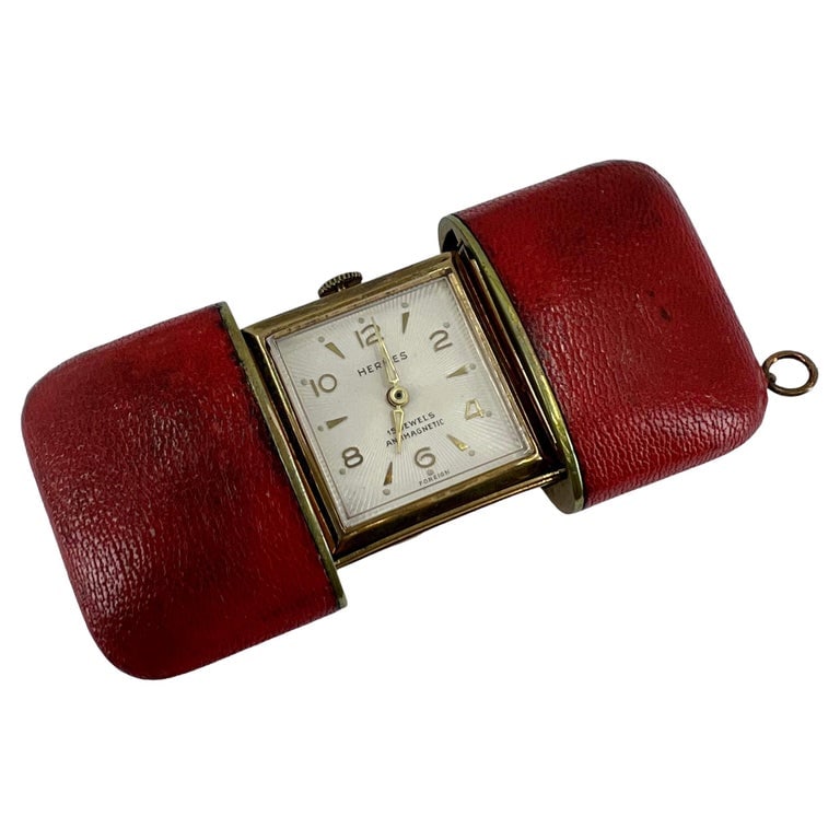 Vintage Hermes Travel Watch C.1960s: Title: Vintage Hermes Travel Watch C.1960s Description: A rare time piece by Hermes, a vintage travel watch. The watch set ina red leather case equipped with a slide opening mechanism. â€&#