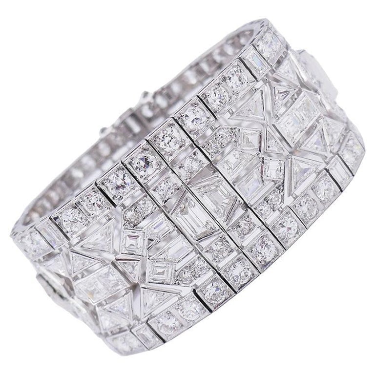 Wide Vintage Diamond Platinum Bracelet Art Deco Revival: Title: Wide Vintage Diamond Platinum Bracelet Art Deco Revival Description: An exquisite wide vintage diamond platinum bracelet in Art Deco revival style. The workmanship of this vintage bracelet is o