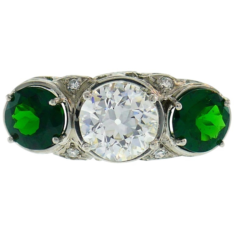 Art Deco Emerald Diamond Platinum Three-Stone Ring: Title: Art Deco Emerald Diamond Platinum Three-Stone Ring Description: Classic Art Deco ring. Elegant, timeless and feminine, the ring is a great addition to your jewelry collection. It can also make 