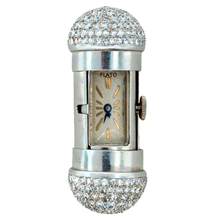 FLATO Platinum and Diamond Travel Watch: Title: FLATO Platinum and Diamond Travel Watch Description: This unusual watch clock was created by Paul Flato in New York in the 1930s. Paul Flato was famous for his whimsical imaginative designs.