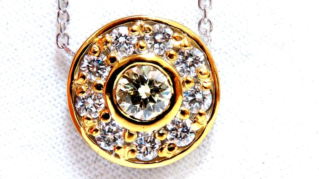GIA Certified .55ct Diamond Cluster Necklace Circular Revolver: Title: GIA Certified .55ct Diamond Cluster Necklace Circular Revolver Description: GIA Certified: .55ct. Round diamond pendant. Full cut brilliant. VVs-1 Clarity. U-V color. Report: 5202346612 .85ct N