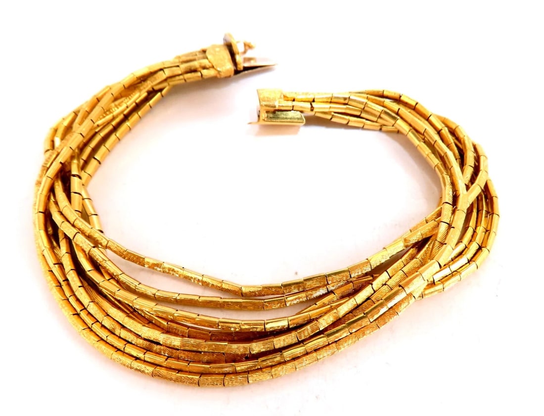 Rustic Nine Stranded 18kt Gold Bracelet 55 Grams 7.5 inch: Title: Rustic Nine Stranded 18kt Gold Bracelet 55 Grams 7.5 inch Description: Nine Strand Chain Link Bracelet Durable, Well Made 18kt. yellow gold 55 Grams. 7.5 inch long Each chain 1.8mm All Items
