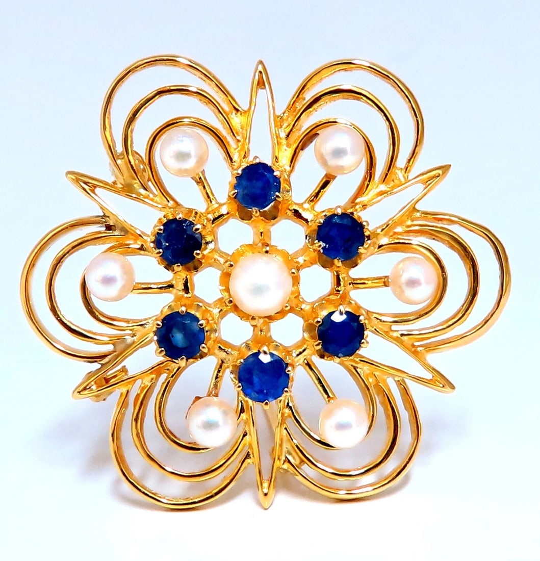 Cosmopolitan 14kt Gold Sapphire Pearl Pin 14kt: Title: Cosmopolitan 14kt Gold Sapphire Pearl Pin 14kt Description: Cosmopolitan Deco Pin Very Well Made .70ct natural sapphires 7 Cultured Pearls 3-4 mm 37 x 34mm 14kt. yellow gold 9.9 Grams.