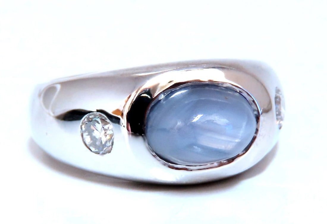 6ct Natural Gray Blue Sapphire Ring 14 Karat Cabochon Sugarloaf cut: Title: 6ct Natural Gray Blue Sapphire Ring 14 Karat Cabochon Sugarloaf cut Description: Raised halo sugarloaf. 6ct Natural Cabochon cut sapphire ring. Gray Blue color / Transluscent 9x6mm .40ct