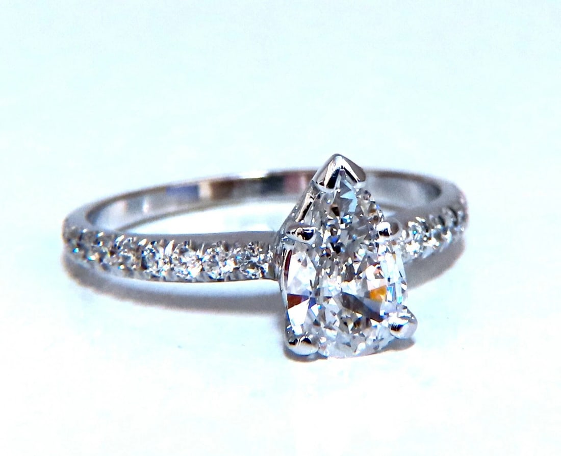 GIA Certified .54ct Natural Pear Shaped Diamond Ring 14kt: Title: GIA Certified .54ct Natural Pear Shaped Diamond Ring 14kt Description: Pear Accent Prime GIA Certified .54ct. Pear shaped diamond ring. Report Id: 1196675002 E-color Si-1 clarity Please see att
