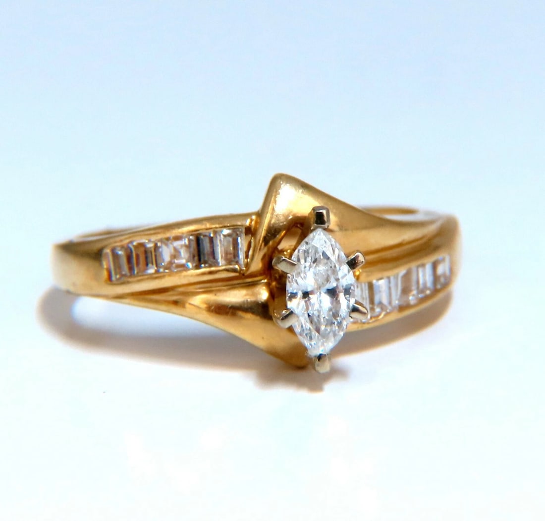 .53ct Natural Marquise Cut Natural Diamond Ring 14kt. Raised: Title: .53ct Natural Marquise Cut Natural Diamond Ring 14kt. Raised Description: Marquise & Baguette Vintage Ring .25ct Natural Marquise Cut Diamond & .28ct Side Baguettes Center: 5.5 x 3.2mm Si-2