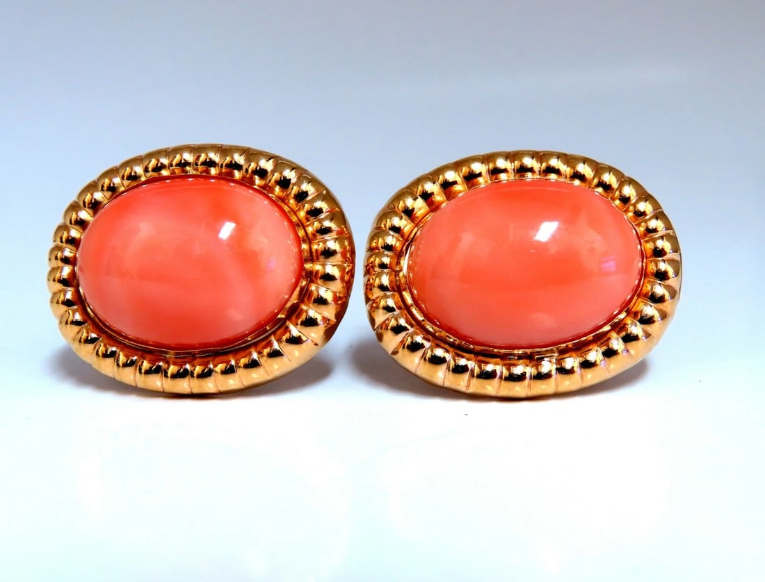 20mm Natural Coral Clip Earrings 14kt: Title: 20mm Natural Coral Clip Earrings 14kt Description: 20 x 15mm Natural Coral Earrings 14KT yellow gold. 13.4 grams Comfortable Omega Over all earrings diameter: 1.08 x .86 inch All Items come