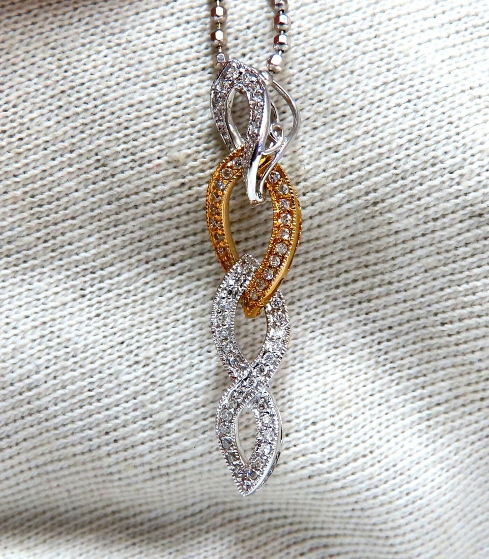 .33ct Natural Diamonds Dangle Necklace 14kt: Title: .33ct Natural Diamonds Dangle Necklace 14kt Description: Elegant Intertwined Prime Iconic .33ct. Natural diamonds necklace. Full cut and Brilliant H-color, Vs2 clarity 1.1 x .2 inch 16 inch nec