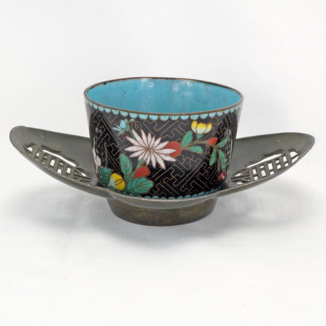 Qing Chinese Tea Saucer/Cloisonne Teacup: Title:Qing Chinese Tea Saucer/Cloisonne Teacup Size:Saucer - 5 1/8 in (13.0 cm) long x 3 3/4 in (9.5 cm) wide x 1 1/4 in (3.2 cm) tall. Teacup - 2 3/4 in (7.0 cm) diameter x 2 in (5.1 cm) tall. Descri