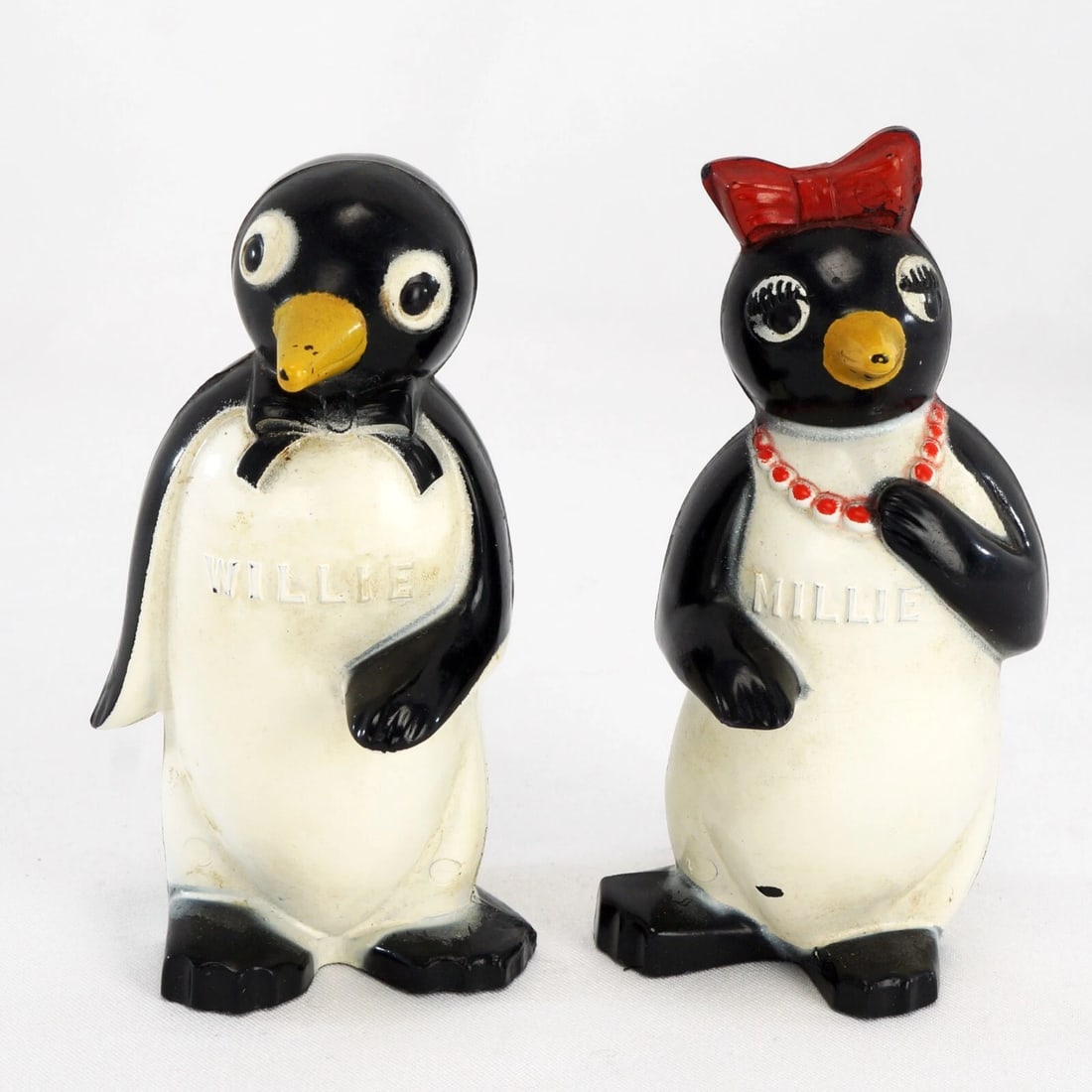 1950s Penguin Cigarettes Salt/Pepper Shakers: Title:1950s Penguin Cigarettes Salt/Pepper Shakers Size:3 3/8 in (8.4 cm) tall. Description:A fun pair of plastic salt and pepper shakers advertising Kool cigarettes. The couple has their names