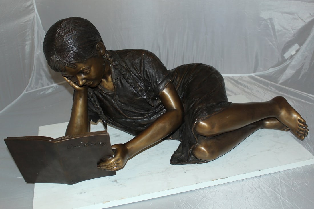 Girl laying reading a book Bronze Statue - Size: 36"L x 17"W x 18"H. - 13