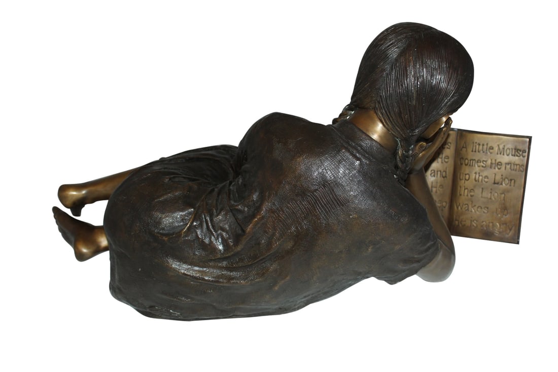 Girl laying reading a book Bronze Statue - Size: 36"L x 17"W x 18"H. - 4