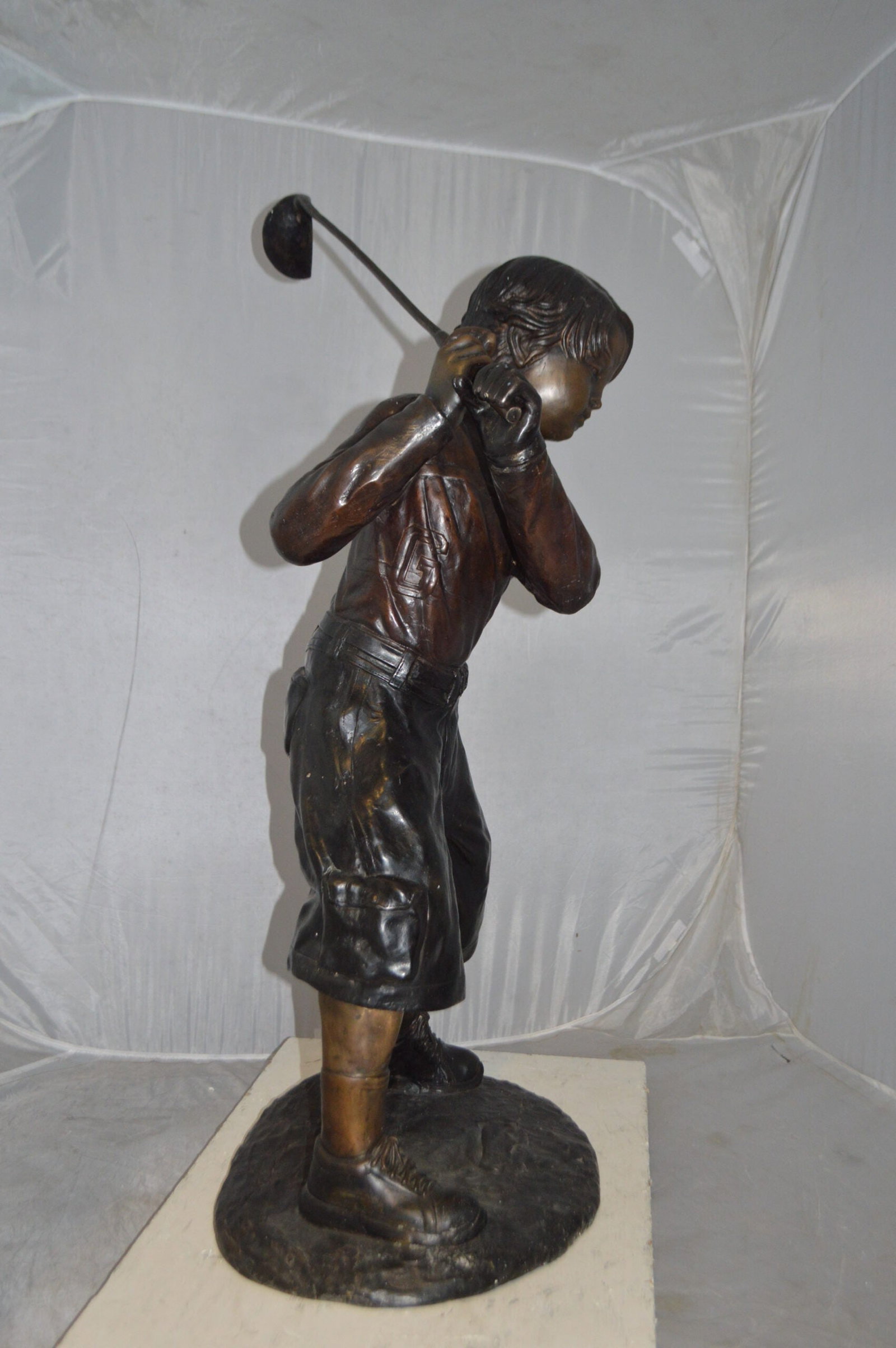 Young Boy Plays Golf Bronze Statue - Size: 19"L x 21"W x 45"H. - 10