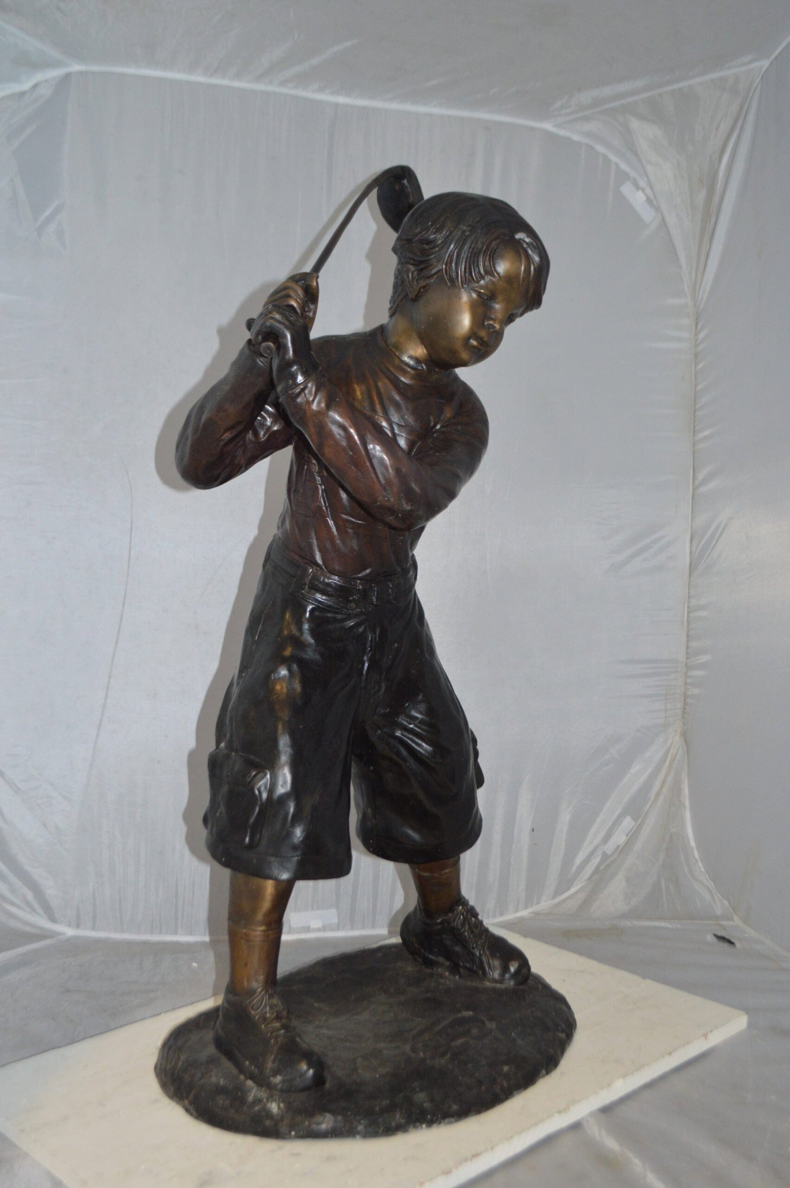 Young Boy Plays Golf Bronze Statue - Size: 19"L x 21"W x 45"H. - 11