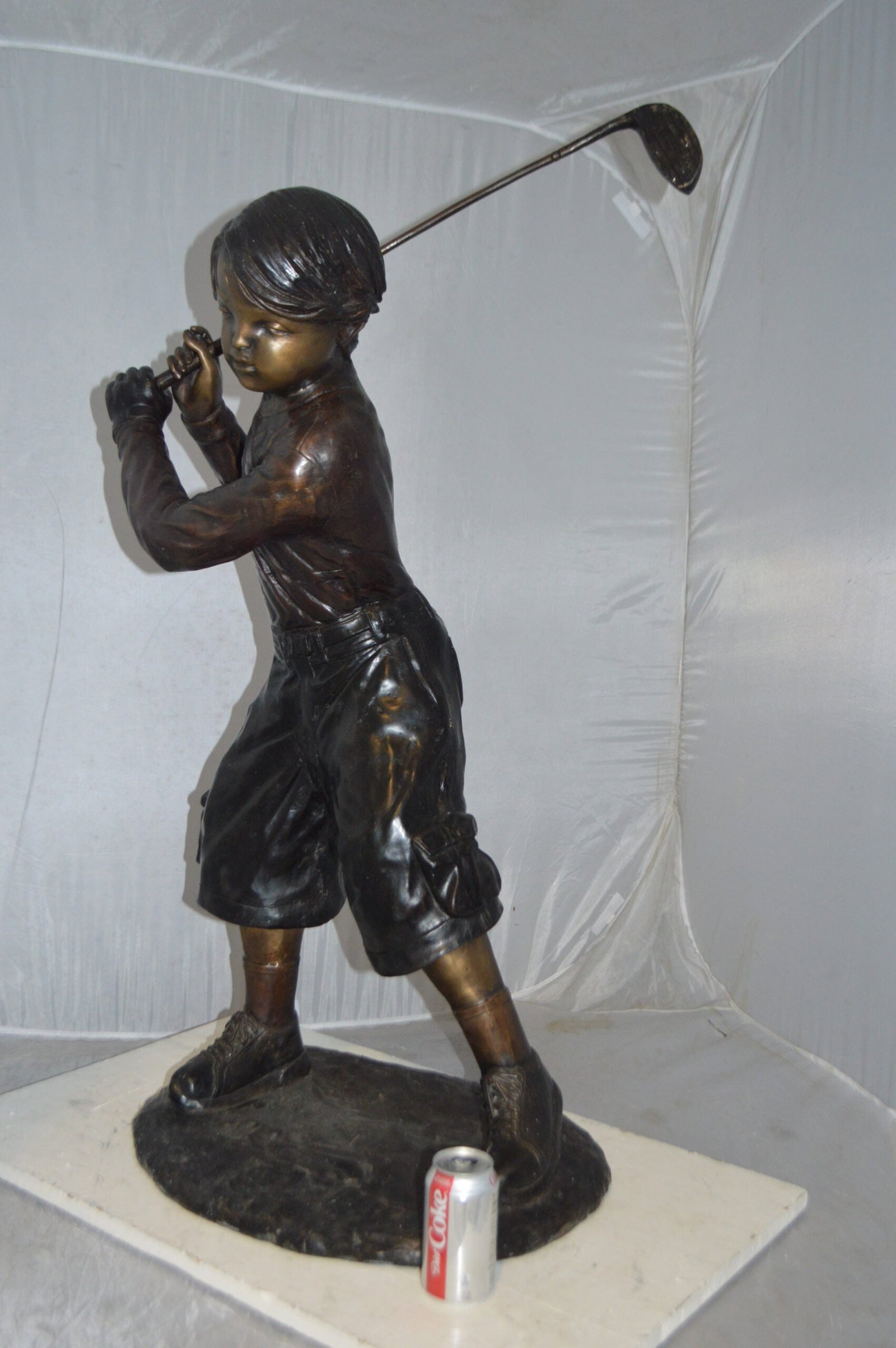 Young Boy Plays Golf Bronze Statue - Size: 19"L x 21"W x 45"H. - 5