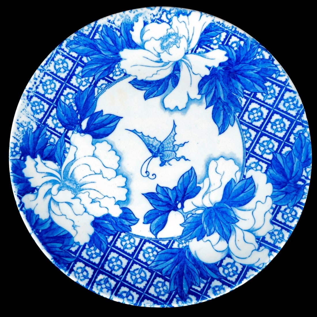 Japanese Igezara Transferware Charger c 1900: Title:Japanese Igezara Transferware Charger c 1900 Size:12 in (30.5 cm) diameter x 1 1/2 in (3.8 cm) tall. Description:A heavy blue and white porcelain charger with a butterfly and peony transfer