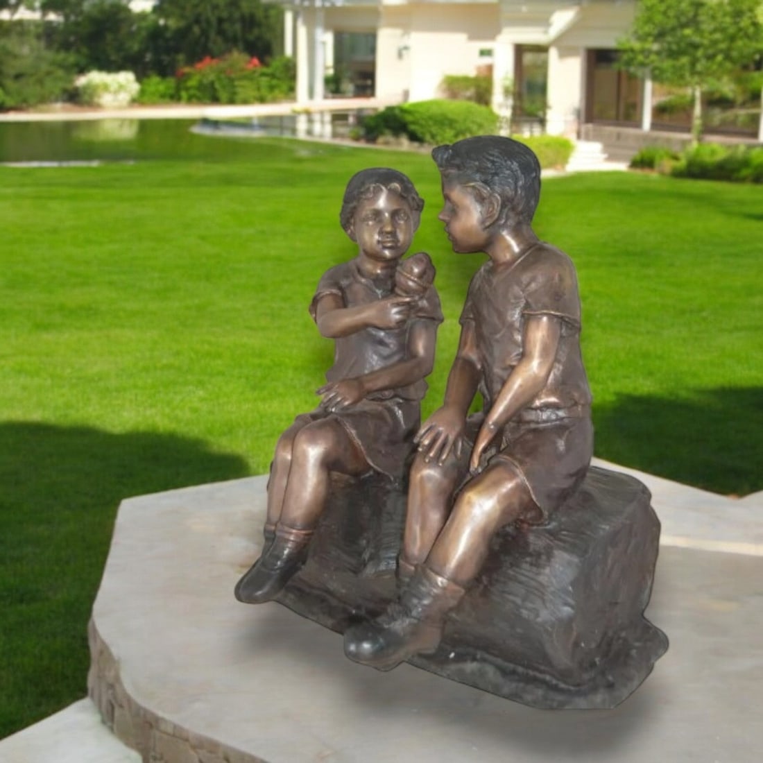Boy and Girl enjoying an ice-cream bronze statue - Size: 28"L x 24"W x 33"H.: Title:Boy and Girl enjoying an ice-cream bronze statue - Size: 28"L x 24"W x 33"H. Description:This charming life size statue depicts two little kids sitting on a tree log enjoying an ice-cream