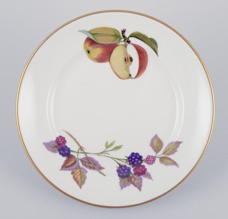 Royal Worcester, England. A set of nine Evesham porcelain plates decorated with fruit and gold trim. - 2
