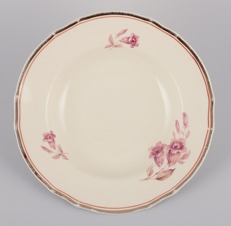 Arabia, Finland. A set of seven deep 'Myrna' faience plates. Approximately 1940s. - 2