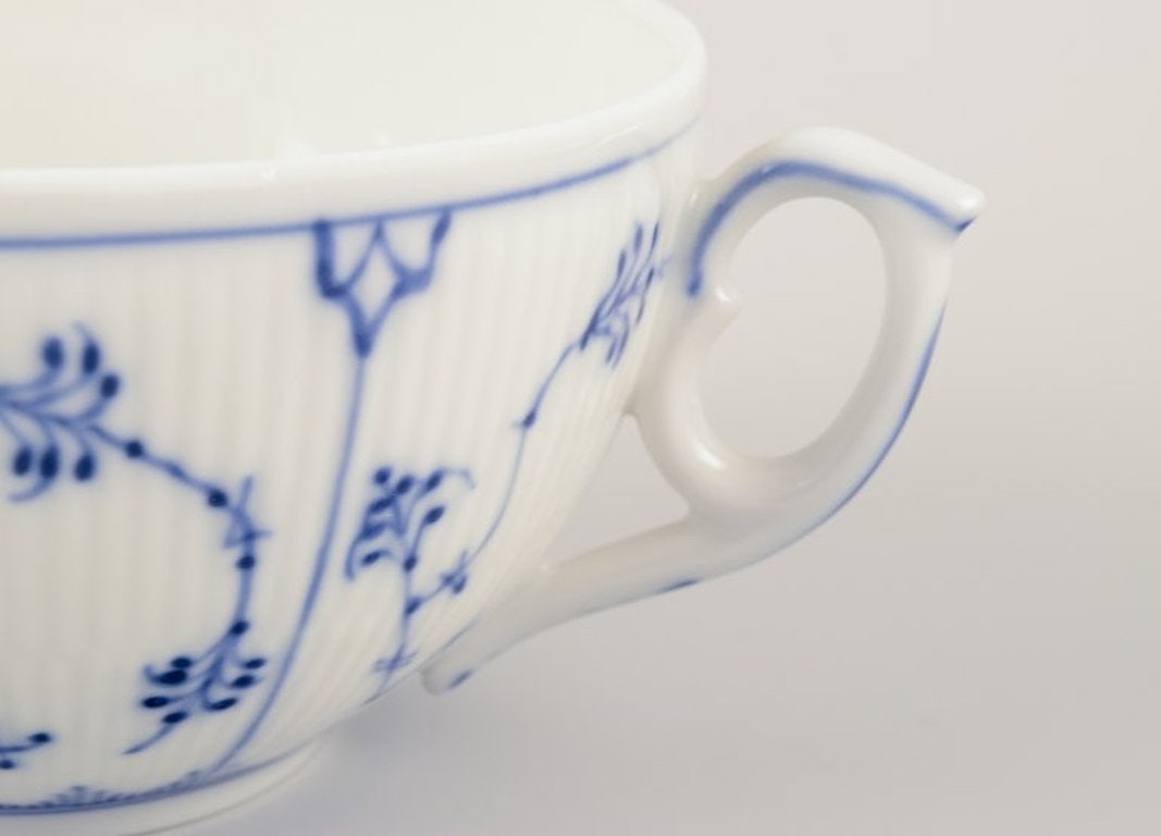 Royal Copenhagen Blue Fluted Plain. A set of four porcelain bouillon cups with matching saucers. - 4
