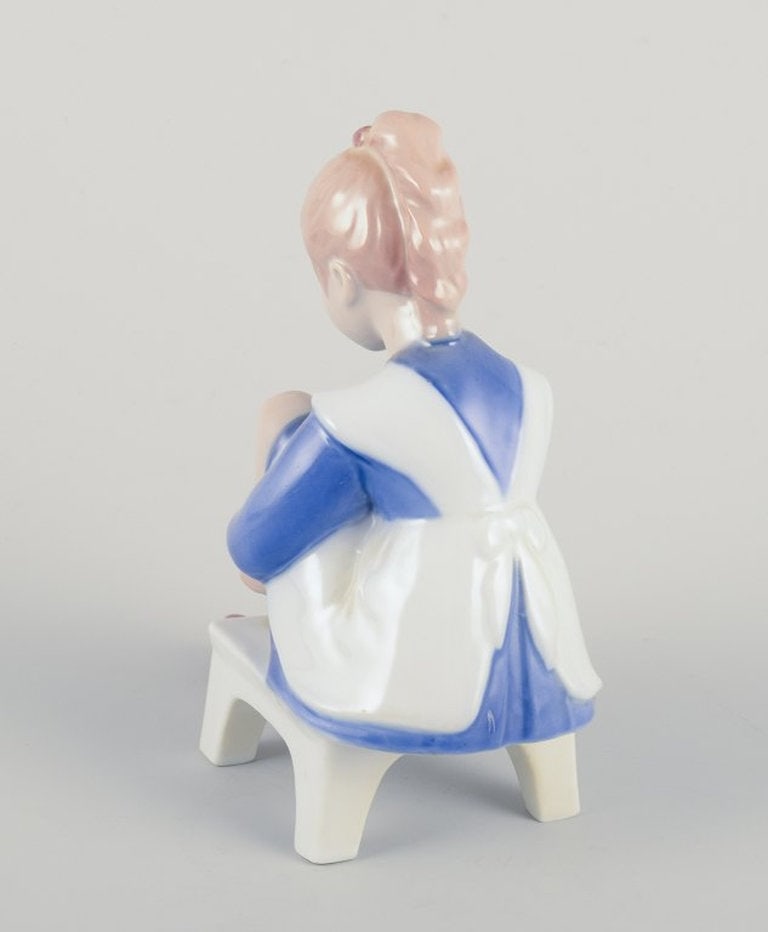 Bing & Grøndahll, Denmark. Porcelain figurine. Sitting girl tying a shoelace. Mid-20th century. - 4