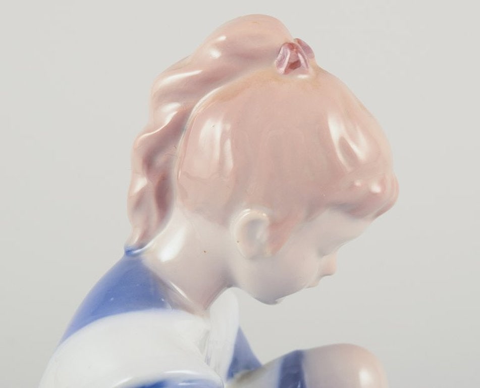Bing & Grøndahll, Denmark. Porcelain figurine. Sitting girl tying a shoelace. Mid-20th century. - 5