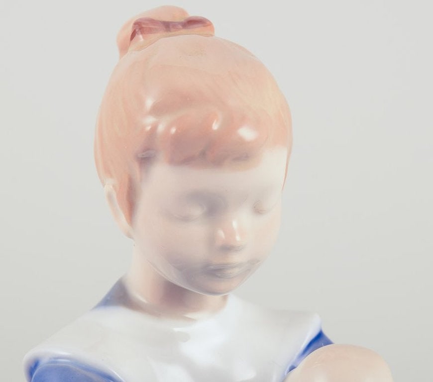 Bing & Grøndahll, Denmark. Porcelain figurine. Sitting girl tying a shoelace. Mid-20th century. - 6
