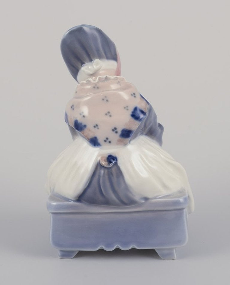 Royal Copenhagen. Porcelain figurine. Amager girl in traditional dress with knitwear. 1930s/40s. - 4