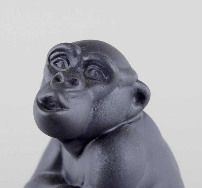 Pia Langelund for Royal Copenhagen. Chimpanzee figure in bisquit mounted on a frosted glass base. - 6