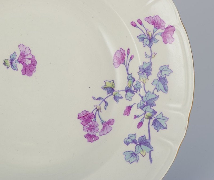 Gustafsberg, Sweden. A set of six deep 'Geranium' earthenware plates. 1918. - 3