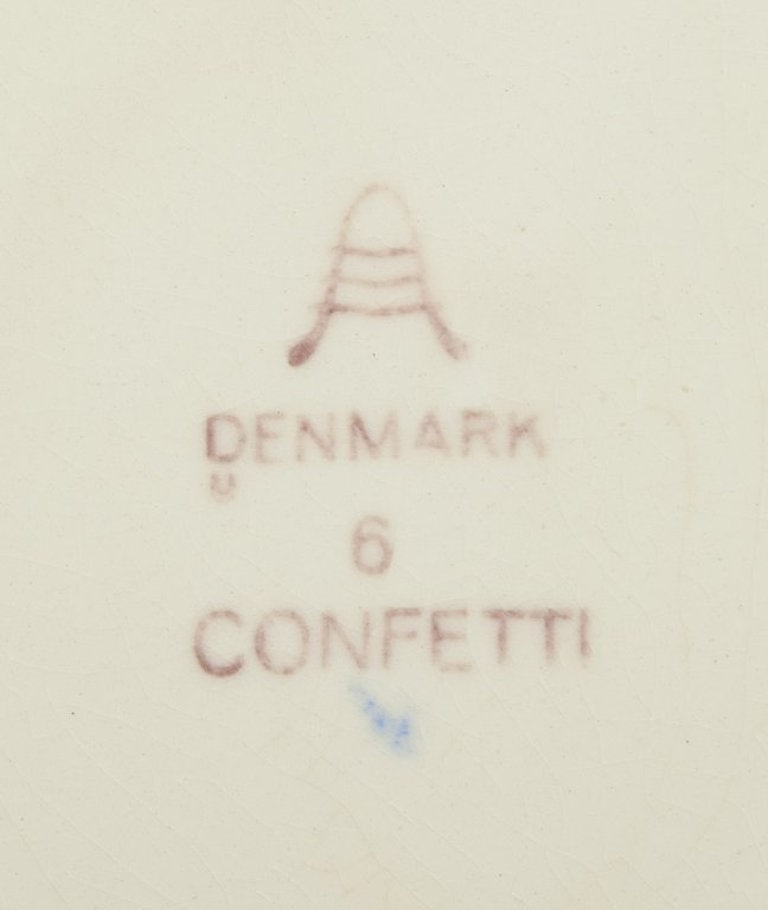 Aluminia, Denmark. Eight 'Confetti' plates in glazed earthenware. Different colours. Mid 20th - 6