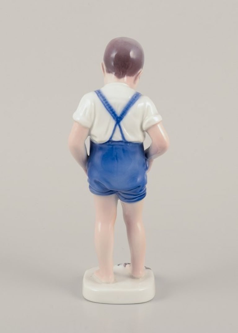 Bing & Grøndahll, Denmark. Porcelain figurine of a boy and crab. Mid-20th century. - 7