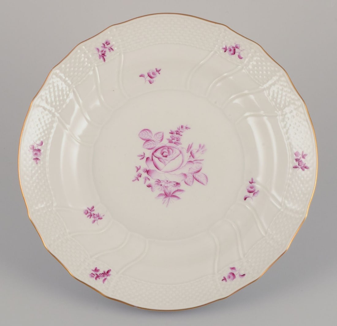 Herend, Hungary. A set of four porcelain dinner plates with purple floral motifs. Mid-20th C - 2