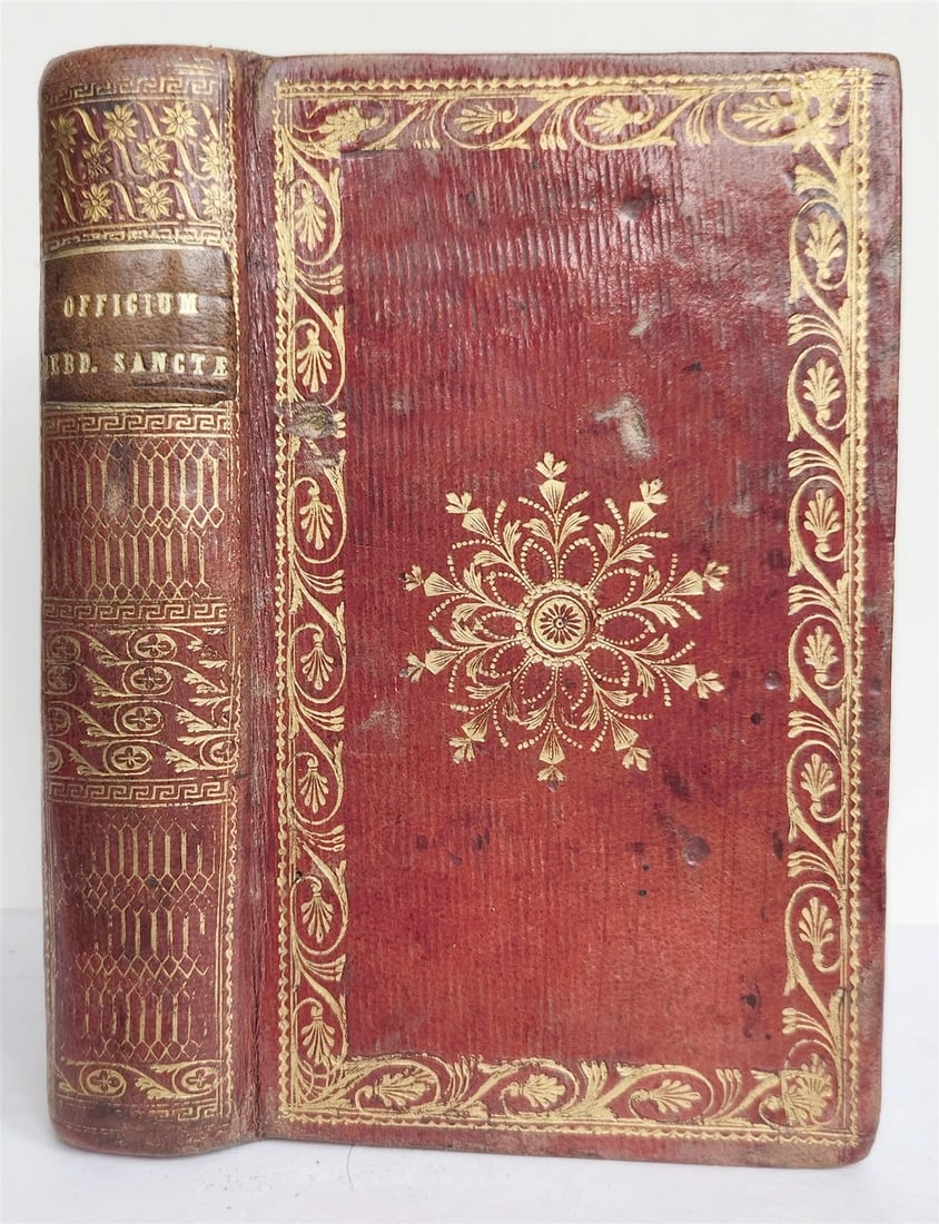1741 OFFICIUM HEBDOMADAE SANCTAE antique DECORATIVE BINDING Holy Week Office: OFFICIUM HEBDOMADAE SANCTAE (Holy Week Office) printed for Dominican Order Rome; 1741 Original red morocco, decorated in gilt, all edges are gilt Text in Latin Size 3 3/4 by 6" good interior condition