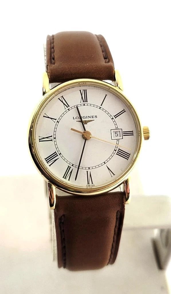Solid 18k Ladies LONGINES Quartz Watch L4 243 6 with Date* EXLNT: This Ladies Longines watch is Swiss made. Great present for yourself or someone you love as well as for vintage collectors or enthusiasts! * Solid 18k yellow gold case & back in shiny finish * Back wi