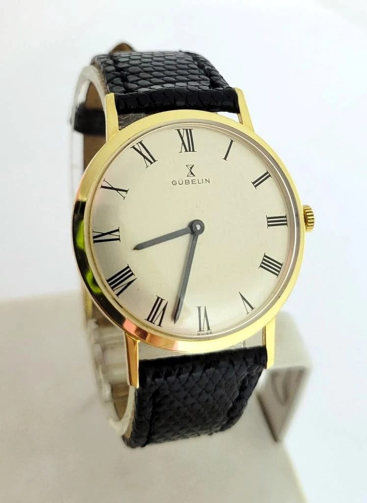 Vintage Solid 18k GUBELIN Mens Winding Watch 1960s Cal G7017 EXLNT RARE High End: Solid 18k yellow gold case in shiny finish * Back with inner markings: Gubelin, Swiss, 5306 0750, 18k, 4/10 213XXX * Case is in high polish * Black color hands & Roman hour numbers * Off white color