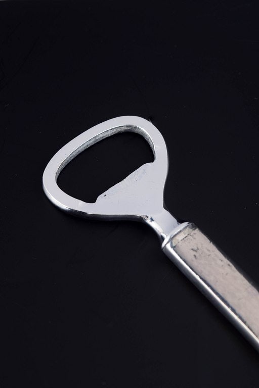Evald Nielsen, Denmark. Art nouveau bottle opener in 830 silver and stainless steel. Approx. 1920s. - 2
