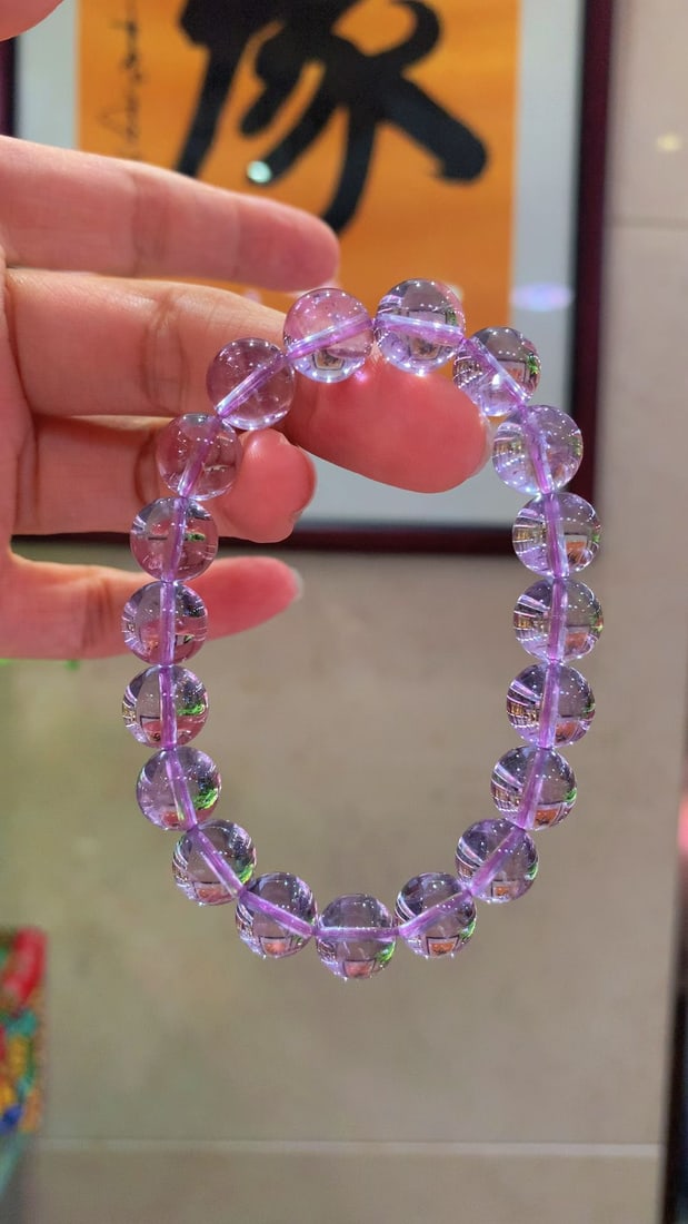 Natural Amethyst Bracelet: Title: Natural Amethyst Bracelet Description: This natural amethyst bracelet showcases a lively and colorful youthful purple. The crystal is clear and bright, with natural sparkling ice flakes. It