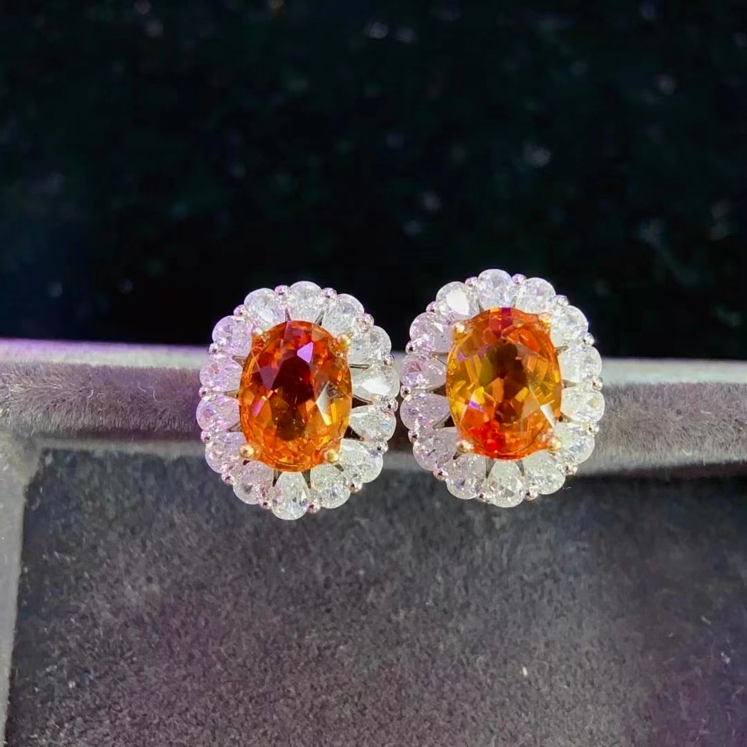925 Silver Natural Citrine Earrings: Title: 925 Silver Natural Citrine Earrings Description: These earrings are finely set in 925 silver, showcasing the natural color of citrine. The crystal is clean, with a warm hue reminiscent of