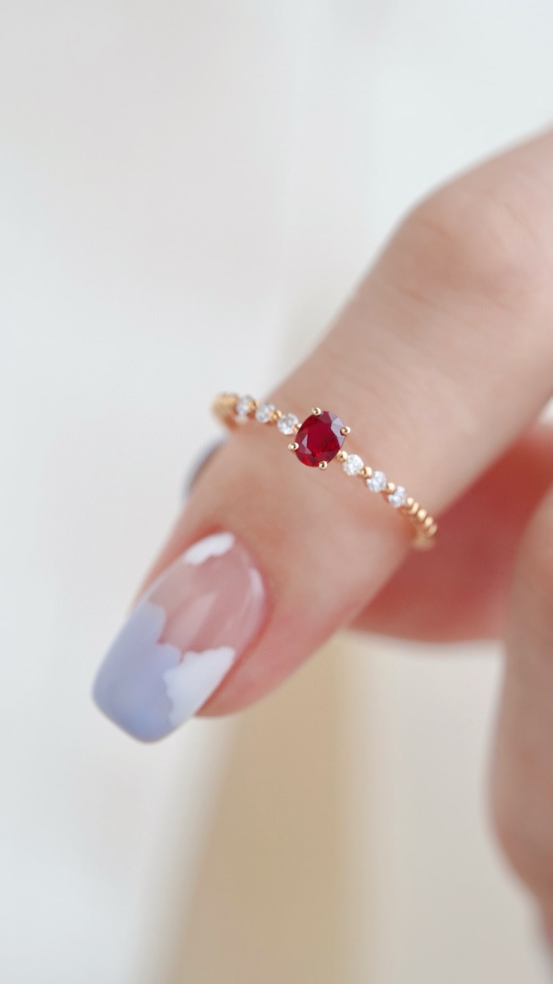 18K Gold Ruby Ring: Title: 18K Gold Ruby Ring Description: This 18K gold ruby ring embodies a perfect blend of classic and elegance. The deep hue of the ruby complements the luster of 18K gold, making it suitable for