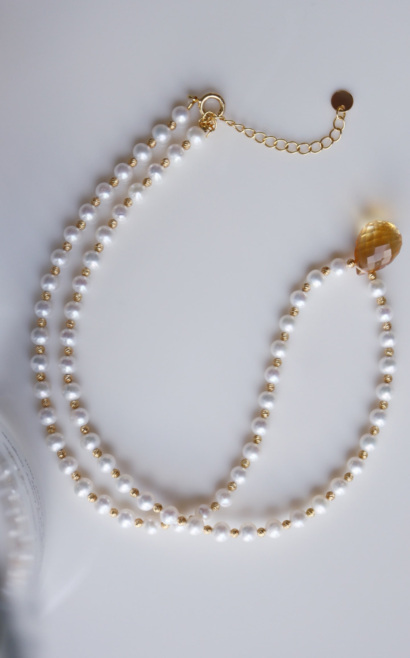 Sterling Silver Natural Pearl and Citrine Necklace: Title: Sterling Silver Natural Pearl and Citrine Necklace Description: The softness of pearls and the brilliance of citrine combine perfectly, presenting a subtle yet sophisticated beauty. The