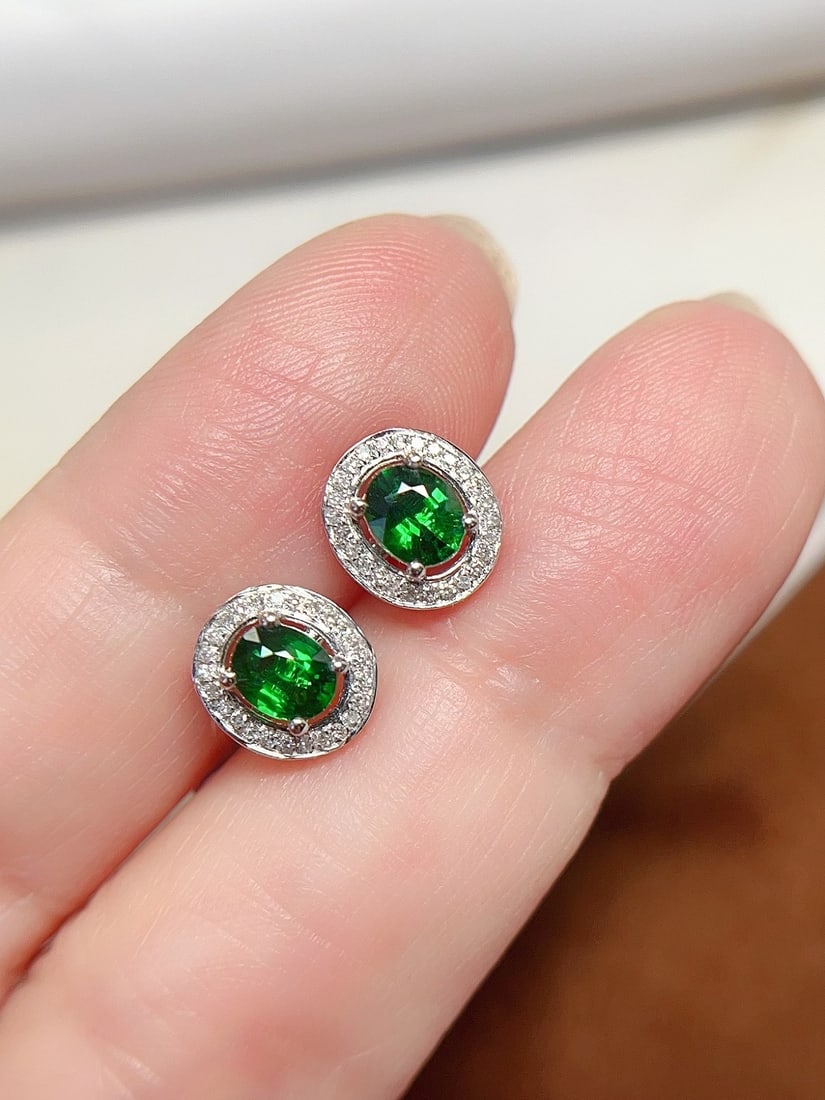 18K Gold Natural Tsavorite Earrings: Title: 18K Gold Natural Tsavorite Earrings Description: These earrings are meticulously crafted in 18K gold, showcasing the enchanting color of tsavorite. The classic design is complemented by 52