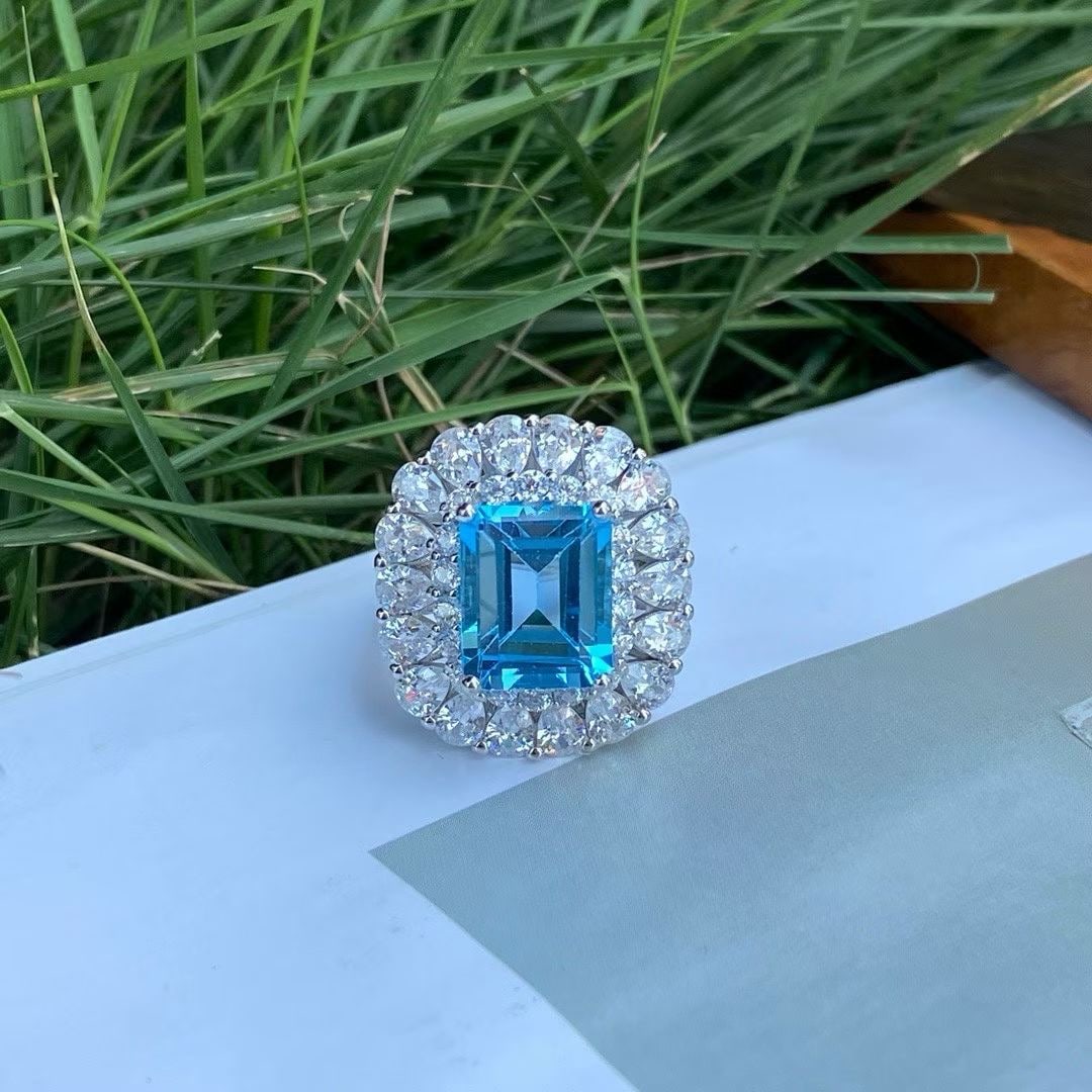 925 Silver Natural Topaz Ring: Title: 925 Silver Natural Topaz Ring Description: This ring is meticulously crafted in 925 silver, set with a natural topaz, showcasing a unique cool elegance. The main stone measures 9*11mm,
