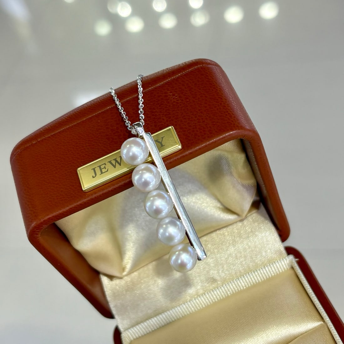 Sterling Silver Freshwater Pearl Earrings: Title: Sterling Silver Freshwater Pearl Earrings Description: These earrings feature 7-7.5MM round freshwater pearls with slight blemishes, paired with meticulously crafted sterling silver